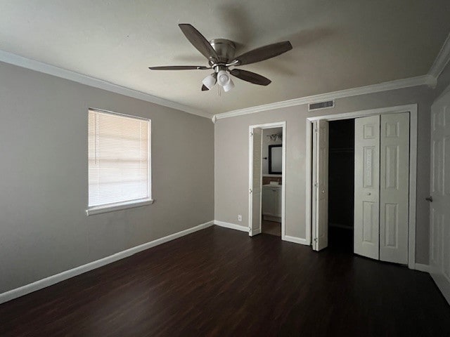 unfurnished bedroom featuring dark hardwood / wood-style flooring, crown molding, a closet, and ceiling fan