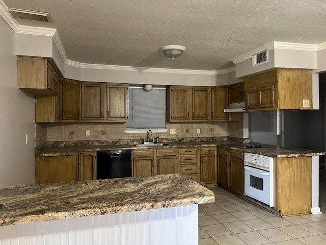 kitchen featuring tasteful backsplash, ornamental molding, sink, and black appliances