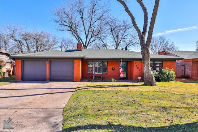 ranch-style home featuring a garage and a front lawn