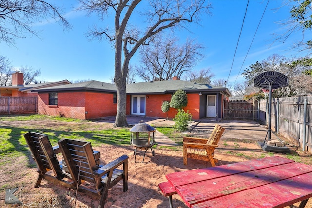 back of property featuring a patio and french doors