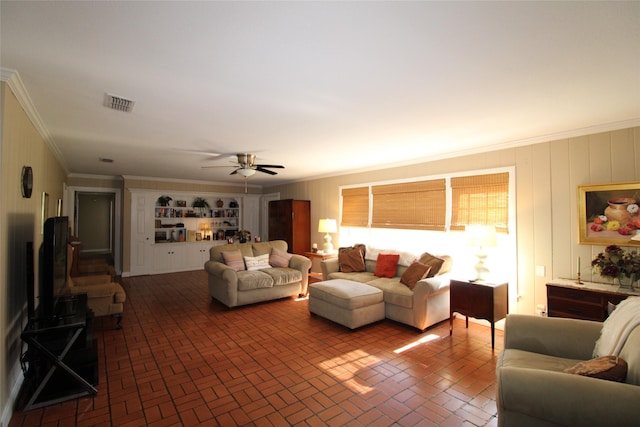 living room with crown molding and ceiling fan