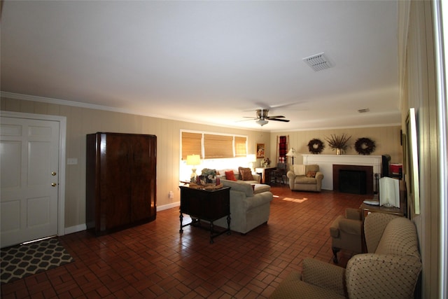 living room featuring crown molding and ceiling fan