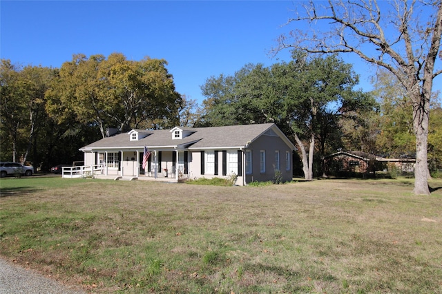 ranch-style home featuring a front yard and a porch