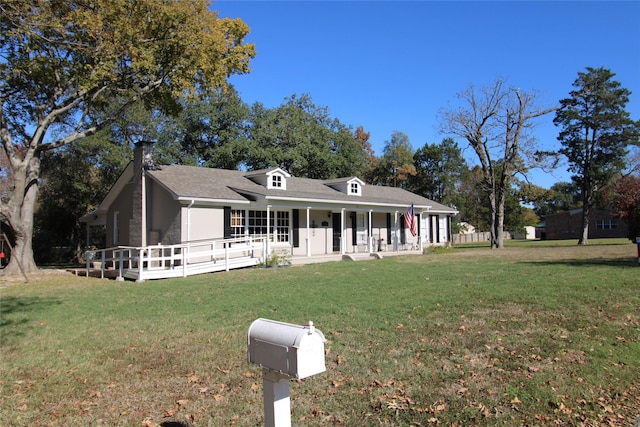 view of front of house featuring covered porch and a front lawn