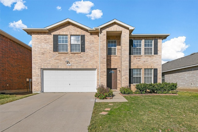 view of front of property featuring a garage and a front lawn