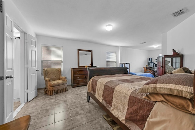 bedroom with light tile patterned flooring