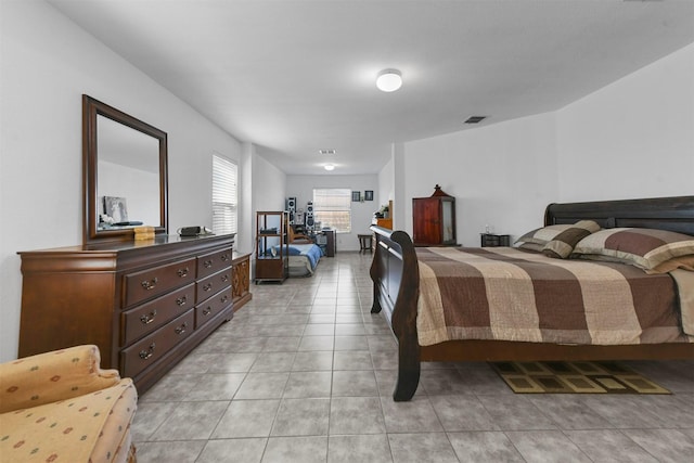 bedroom with light tile patterned flooring