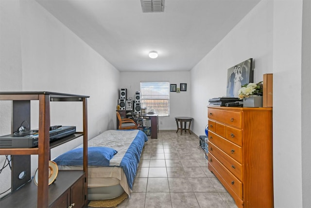 bedroom with light tile patterned flooring