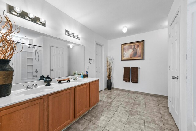 bathroom with tile patterned floors, vanity, and washtub / shower combination