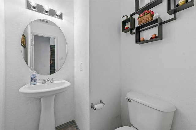 bathroom with sink and toilet