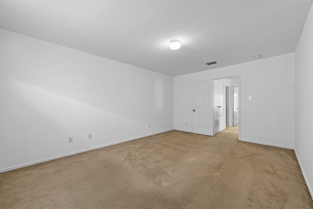 empty room featuring light colored carpet