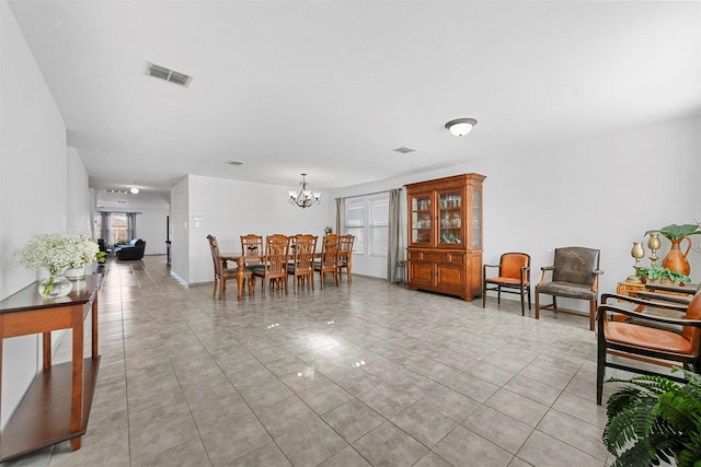 interior space with light tile patterned floors and a chandelier