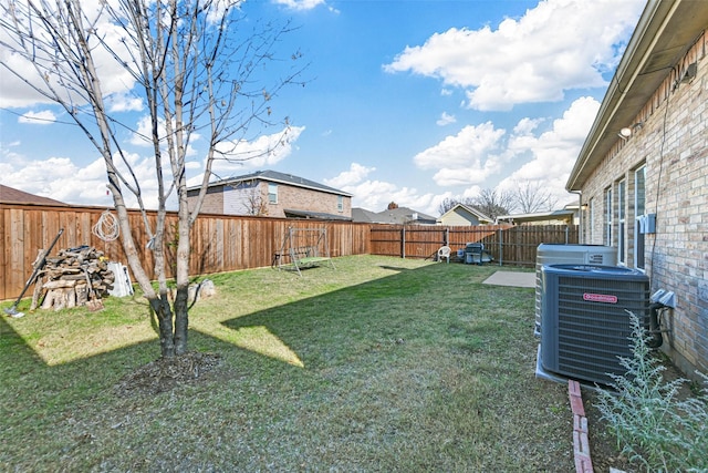 view of yard with central AC unit