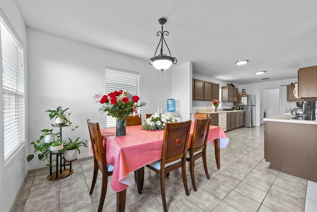 dining space with light tile patterned floors