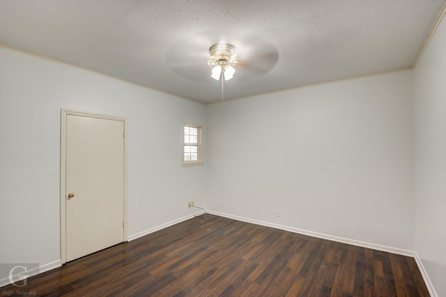 empty room featuring a textured ceiling, ceiling fan, dark hardwood / wood-style floors, and ornamental molding