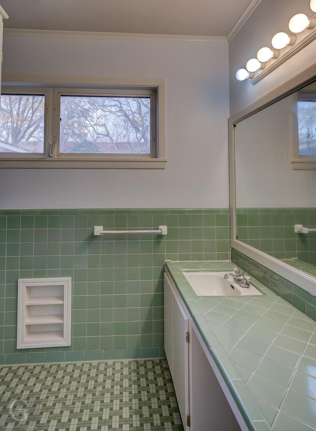 bathroom with vanity, ornamental molding, and tile walls