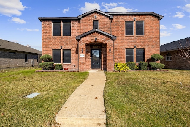 front facade featuring a front lawn