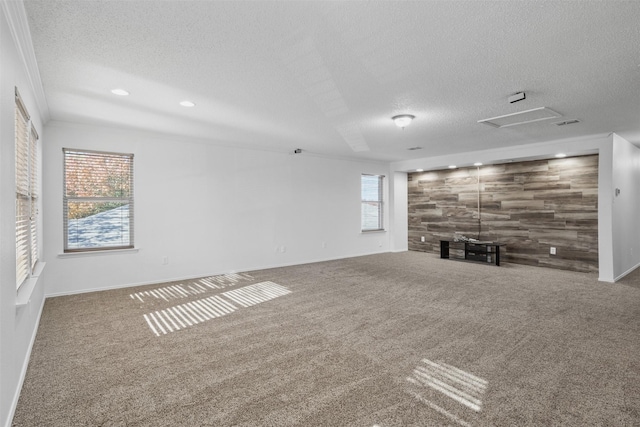 unfurnished living room with carpet flooring and a textured ceiling