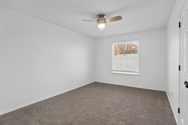 carpeted empty room with ceiling fan and a textured ceiling