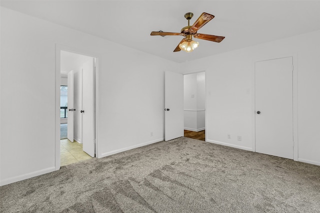 unfurnished bedroom with light colored carpet