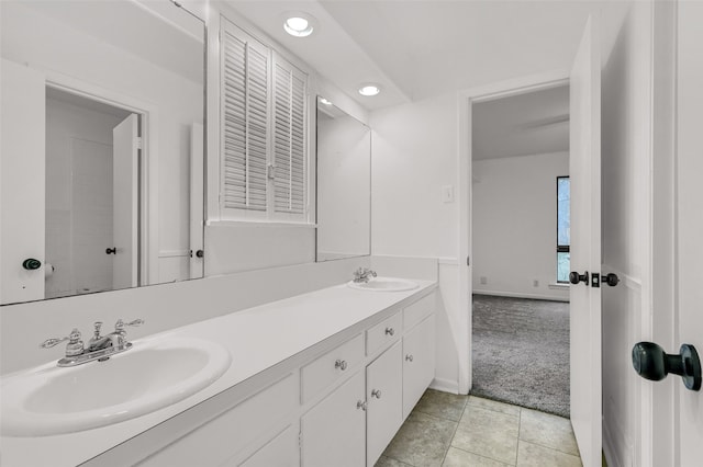 bathroom with vanity and tile patterned flooring