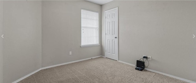 empty room featuring plenty of natural light and light colored carpet