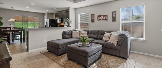 tiled living room featuring plenty of natural light