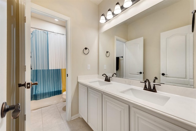 full bathroom featuring vanity, shower / tub combo with curtain, tile patterned floors, and toilet