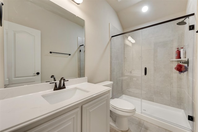 bathroom featuring tile patterned floors, an enclosed shower, vaulted ceiling, toilet, and vanity