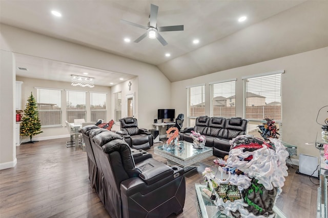 living room featuring lofted ceiling, hardwood / wood-style floors, and ceiling fan