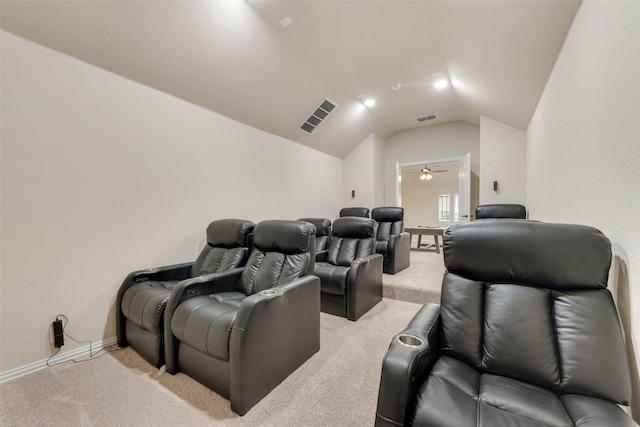 carpeted home theater room featuring ceiling fan and vaulted ceiling