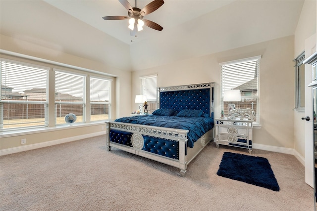 bedroom with carpet floors, vaulted ceiling, multiple windows, and ceiling fan