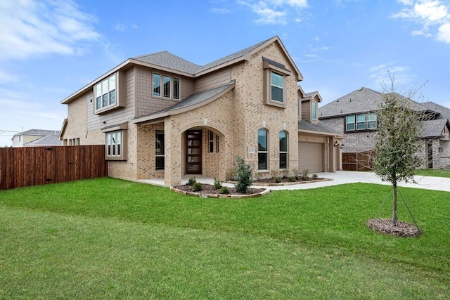 view of front of home featuring a garage and a front yard