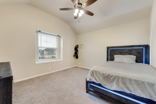 carpeted bedroom with ceiling fan and lofted ceiling