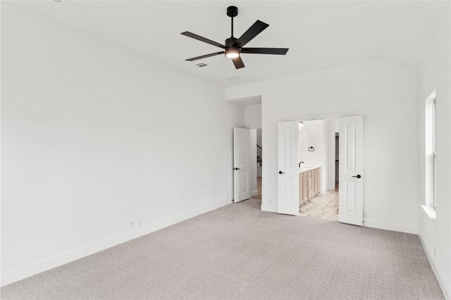 carpeted bedroom with ceiling fan and lofted ceiling