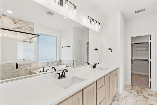 bathroom with vanity, tile patterned flooring, and plus walk in shower