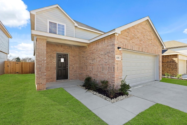 view of front facade with a front yard and a garage