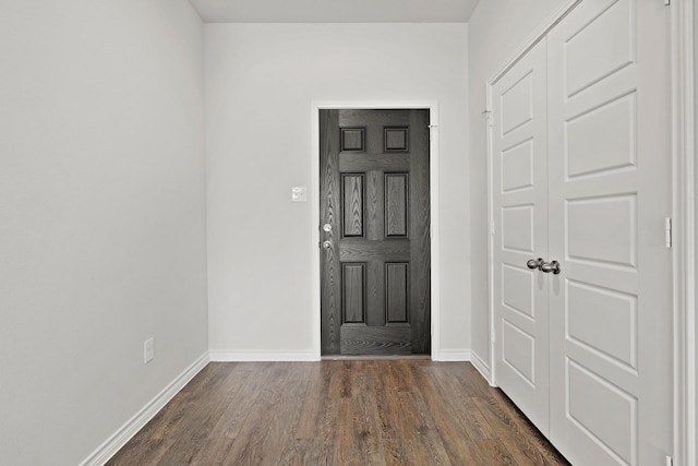 foyer with dark hardwood / wood-style flooring