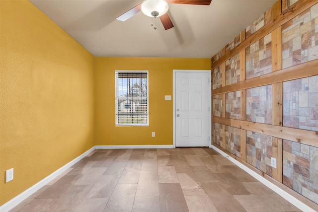 spare room with ceiling fan