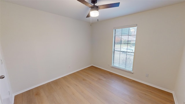 empty room featuring ceiling fan and light hardwood / wood-style flooring