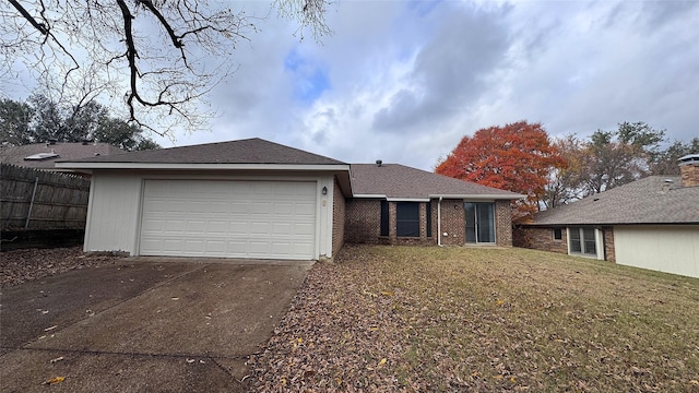 view of front facade featuring a garage and a front lawn