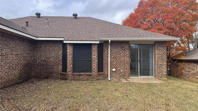 back of house with a yard