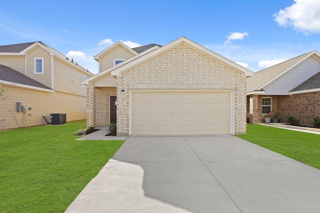 view of front facade with a garage, a front lawn, and central AC unit