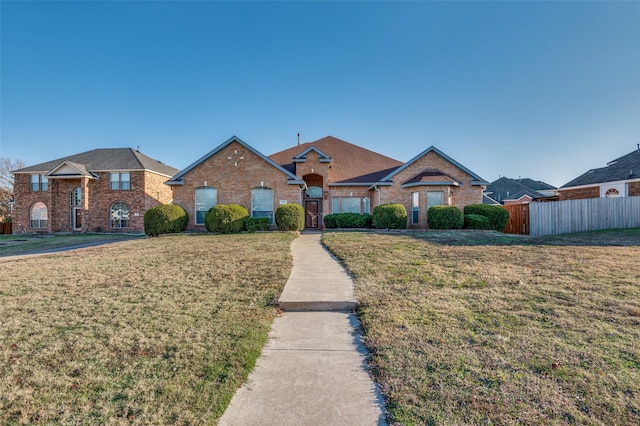 ranch-style house with a front lawn