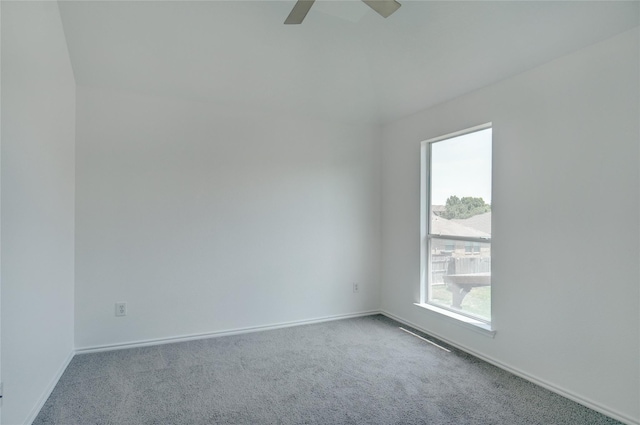 spare room featuring carpet flooring and ceiling fan