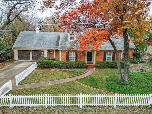 new england style home featuring a garage and a front lawn