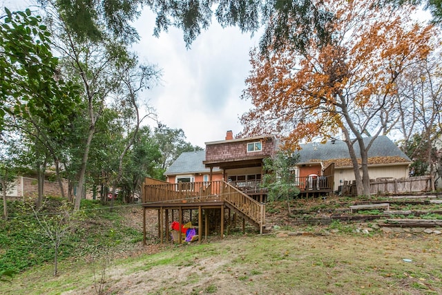 back of house with a wooden deck