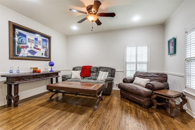 living room with hardwood / wood-style floors, ornamental molding, and a wealth of natural light