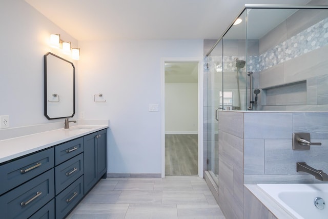 bathroom with vanity and plus walk in shower