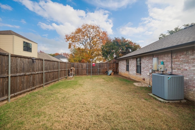 view of yard with central AC